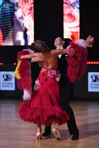 Dancesport competitor: Male dancer: black suit