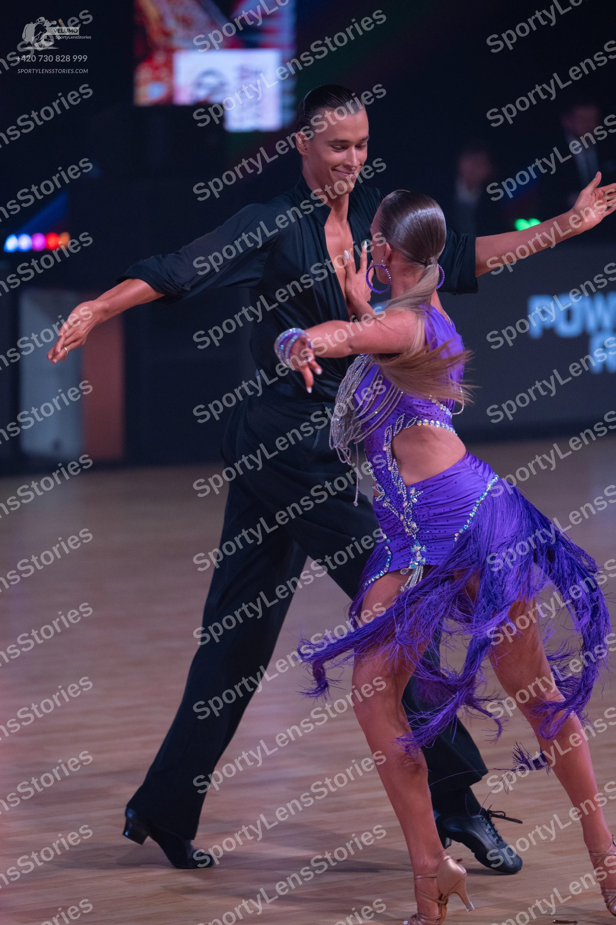 Dancesport competitor: Male dancer: black long-sleeved dance shirt and black trousers