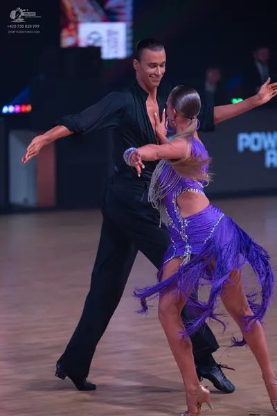 Dancesport competitor: Male dancer: black long-sleeved dance shirt and black trousers
