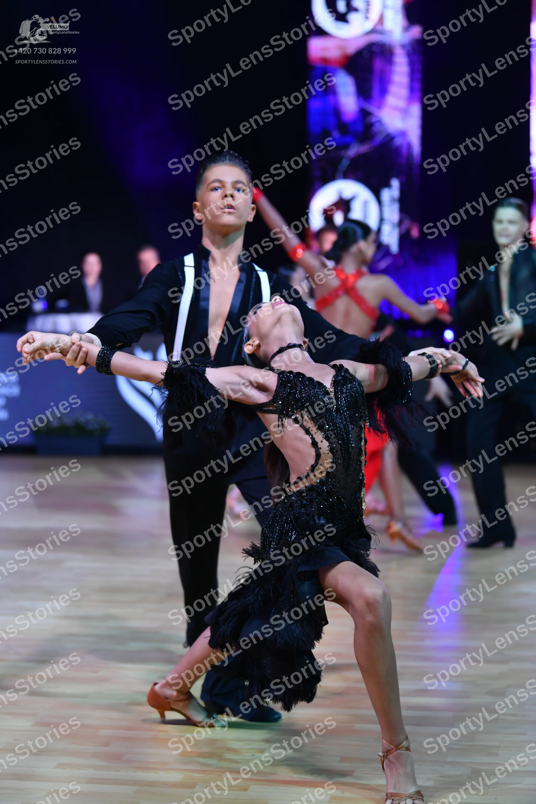 Dancesport competitor: Main male dancer: black long-sleeved Latin dance shirt with white vertical panel