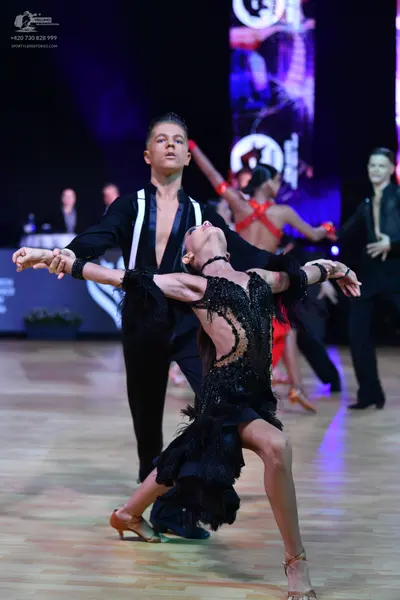 Dancesport competitor: Main male dancer: black long-sleeved Latin dance shirt with white vertical panel