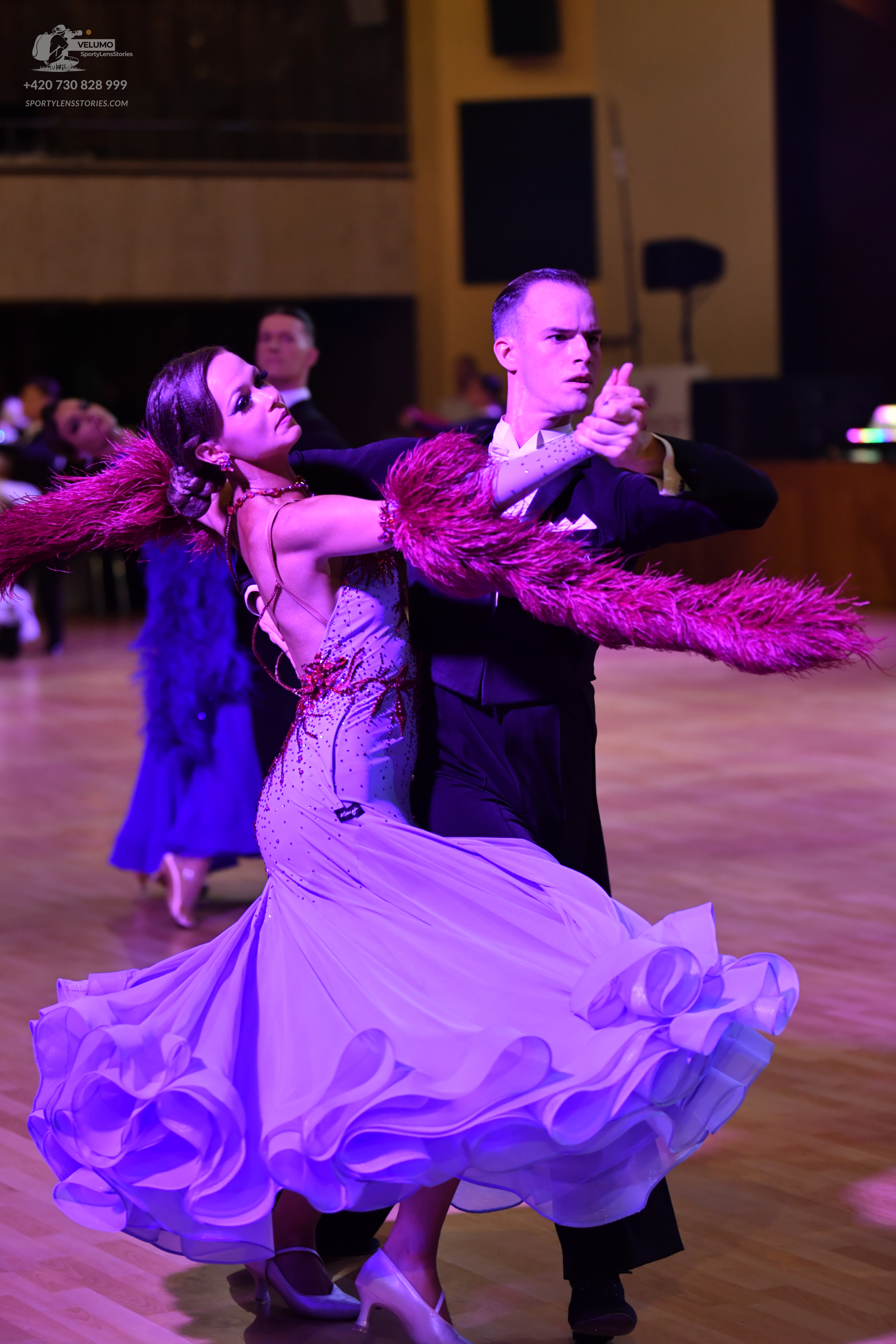 Dancesport competitor: Male dancer: black formal suit with a white shirt