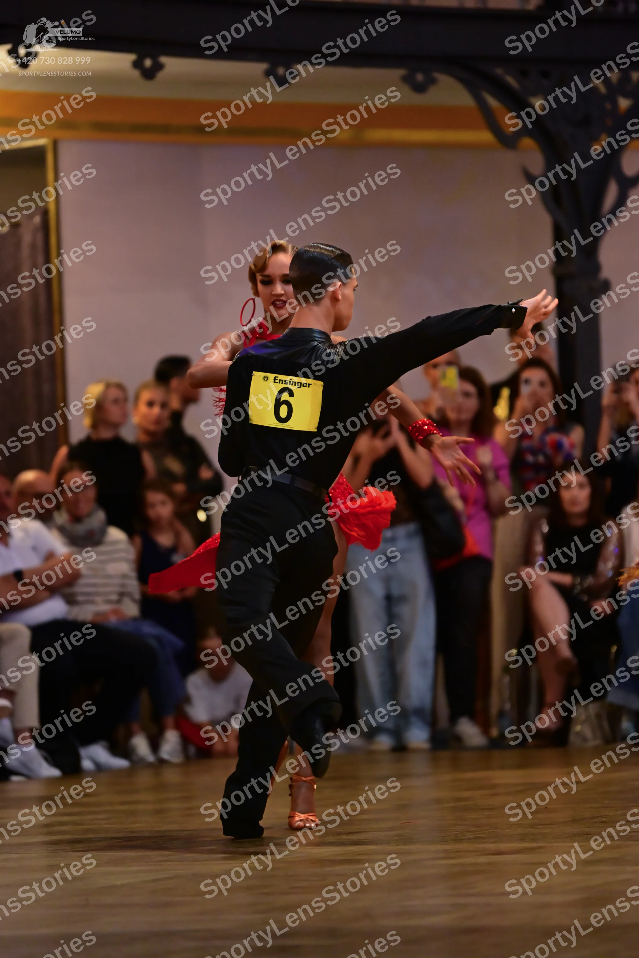 Dancesport competitor: Male dancer: black long-sleeved top and black trousers