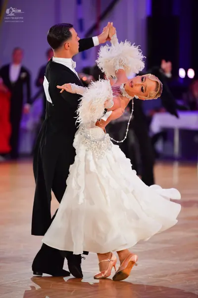 Dancesport competitor: Male dancer: black formal tailcoat with a white shirt and white bowtie