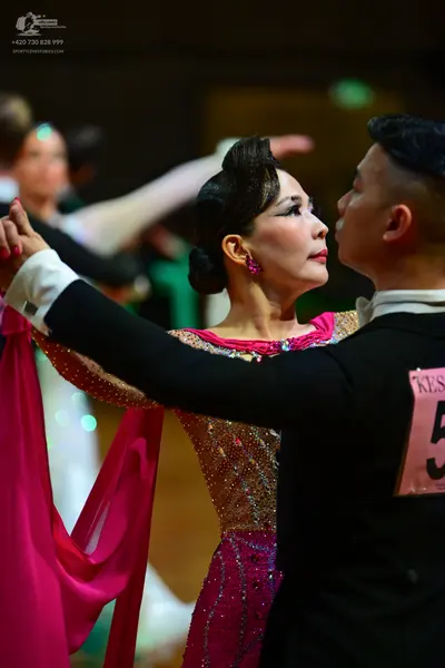 Dancesport competitor: Male dancer: black dance suit with a white shirt