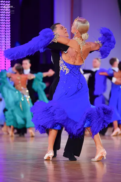 Dancesport competitor: Male dancer: black suit