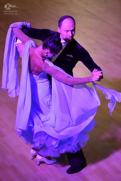 Dancesport competitor: Male dancer: black velvet-like suit jacket with a white shirt collar