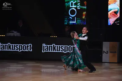 Dancesport competitor: Male dancer: black suit with a white shirt