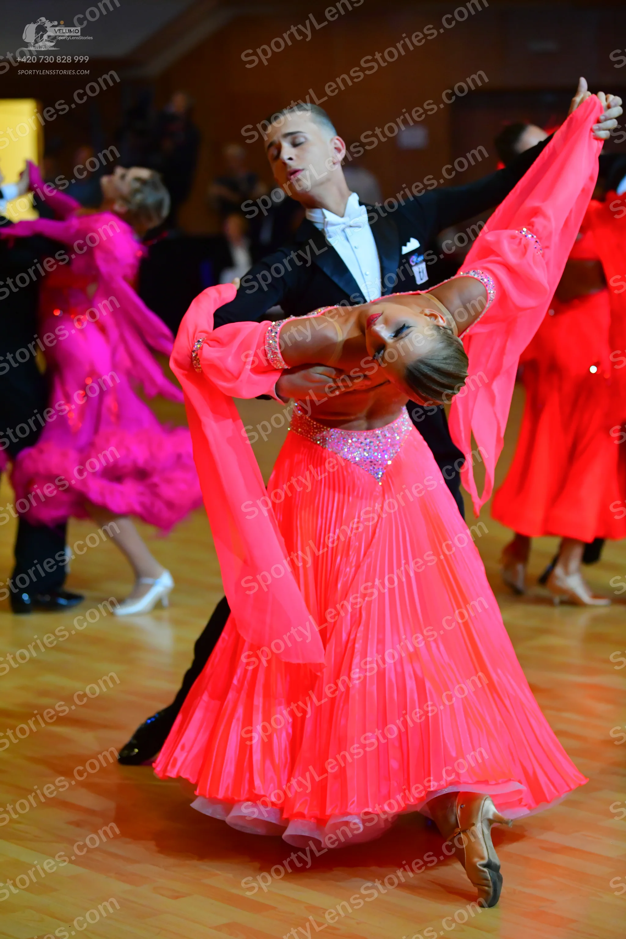 Dancesport competitor: Male dancer: black suit with white shirt and white bowtie