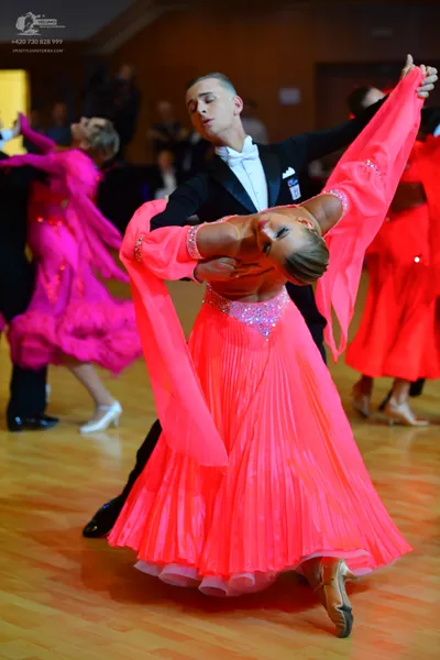 Dancesport competitor: Male dancer: black suit with white shirt and white bowtie