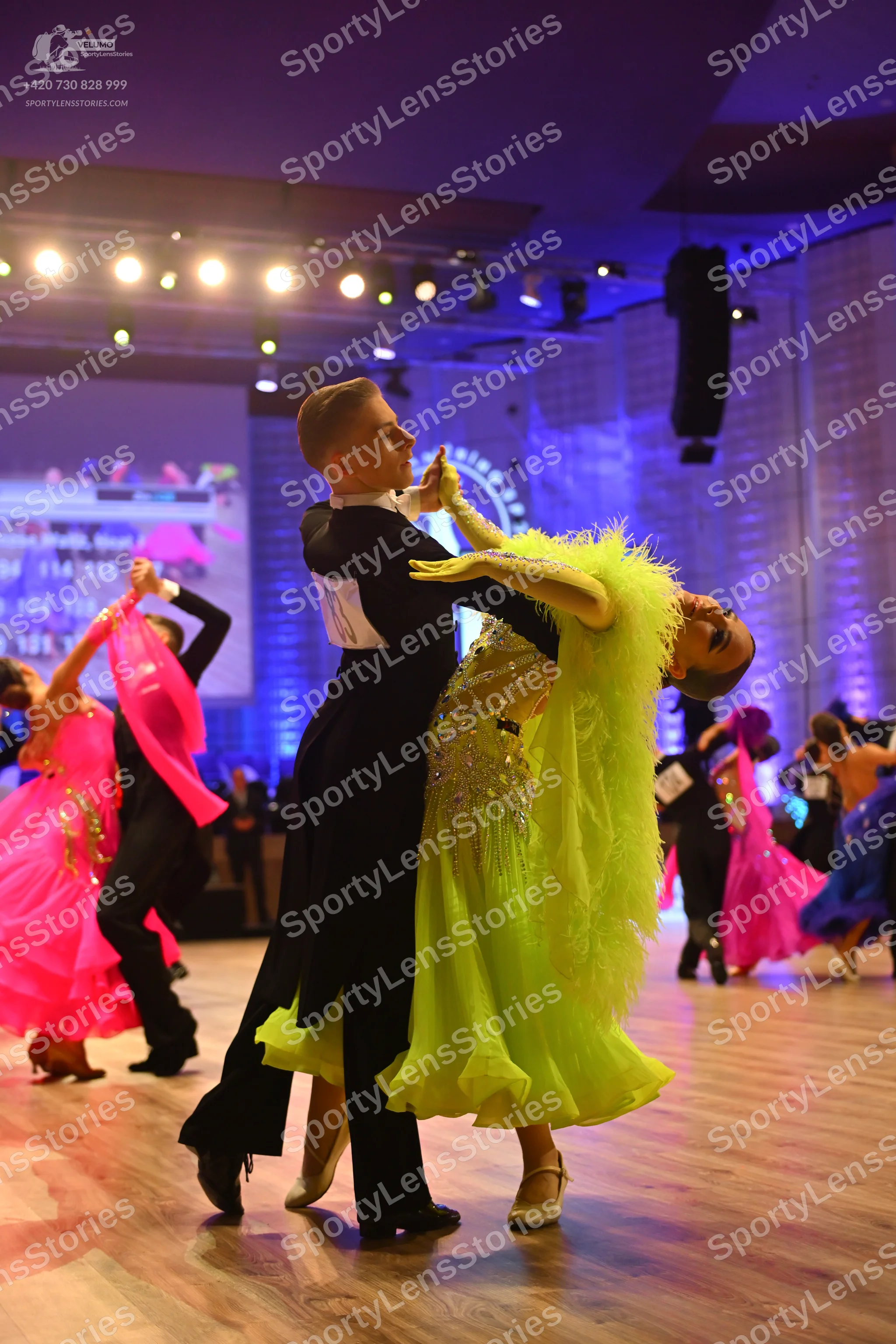 Dancesport competitor: Male dancer: black ballroom suit with a white shirt and stiff collar