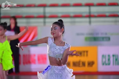 Dancesport competitor: ** White Latin dress