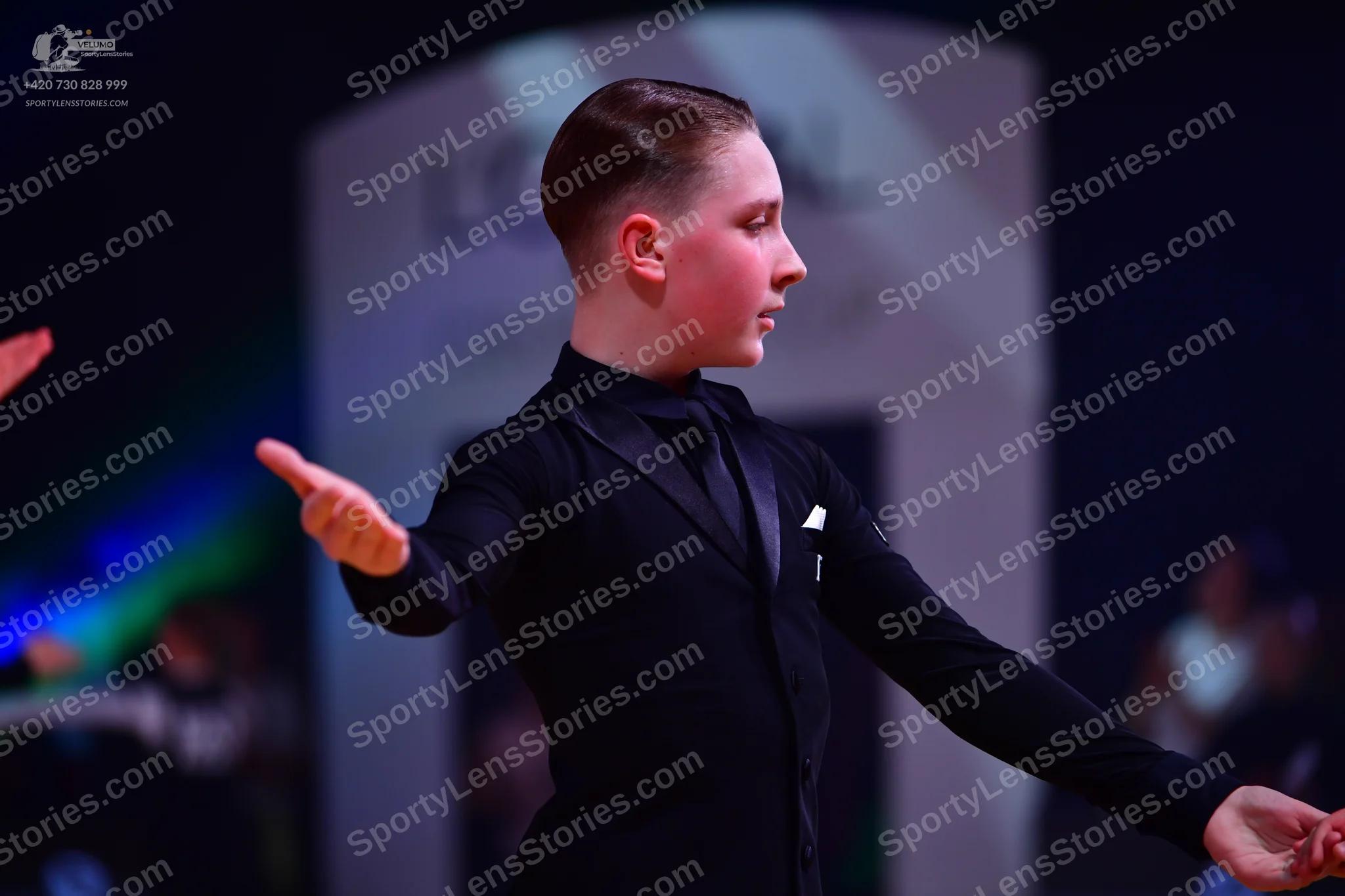 Dancesport competitor: Male dancer: black suit with a black shirt and black tie