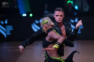 Dancesport competitor: Male dancer: black long-sleeved shirt with subtle sparkles