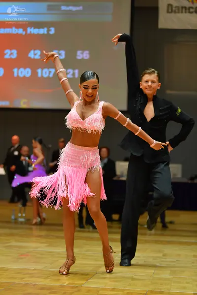 Dancesport competitor: Male dancer: black long-sleeved shirt and black trousers