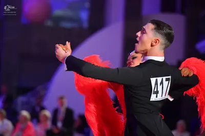 Dancesport competitor #417: Male dancer: black long-sleeved shirt