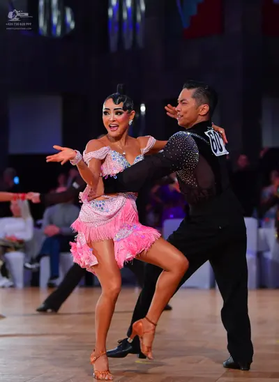 Dancesport competitor #60: Male dancer: black long-sleeved shirt with sequins and black trousers