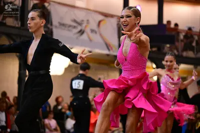 Dancesport competitor #15: Male dancer (foreground): black long-sleeved top and black trousers
