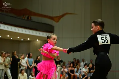 Dancesport competitor #58: Male dancer: black long-sleeved top and black trousers