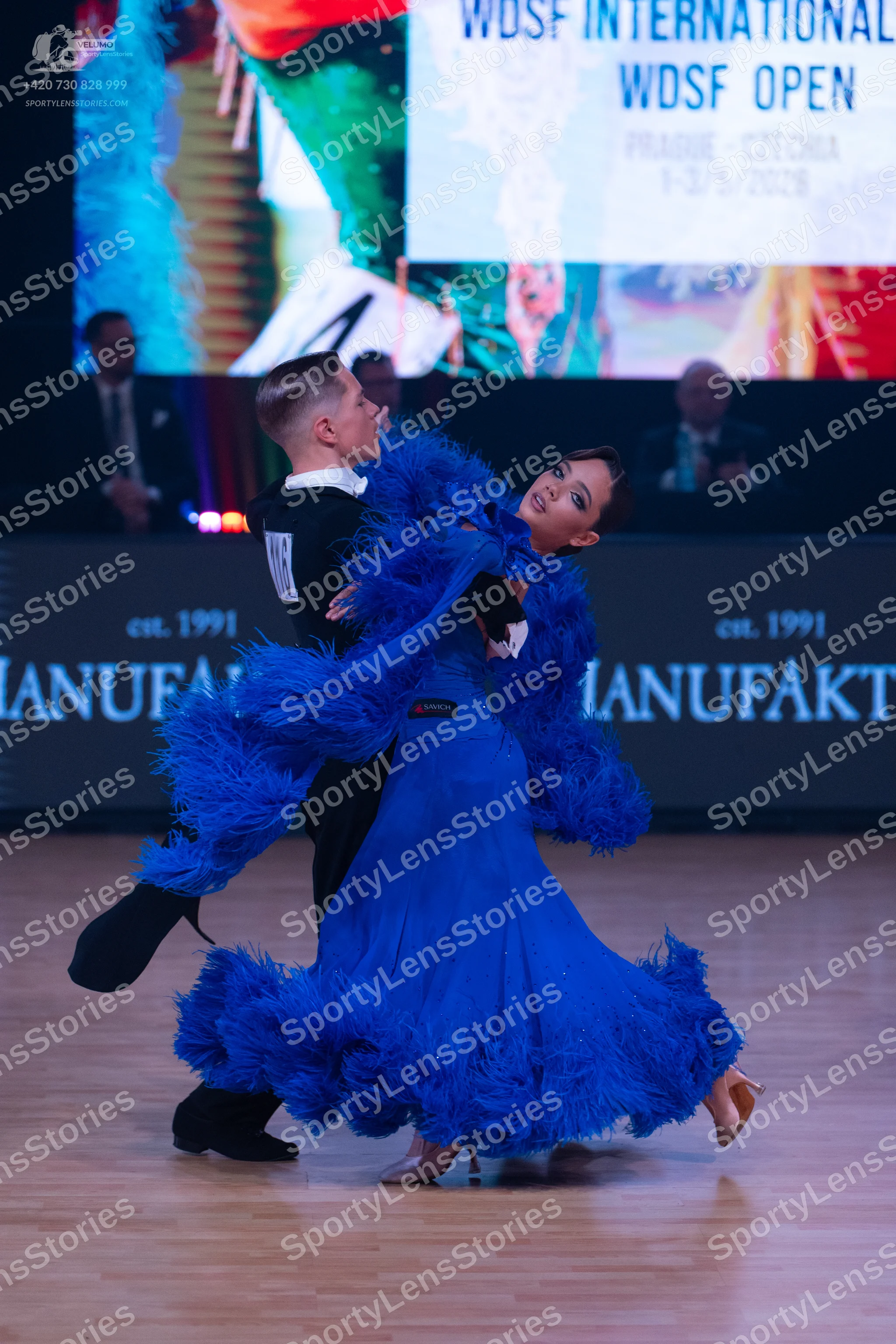 Dancesport competitor: Male dancer: black waistcoat, white shirt, black bowtie, and black trousers