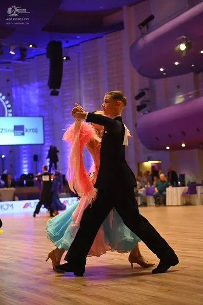 Dancesport competitor: Male dancer: black suit