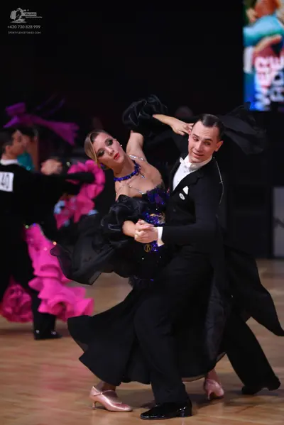 Dancesport competitor: Male dancer on left: black suit