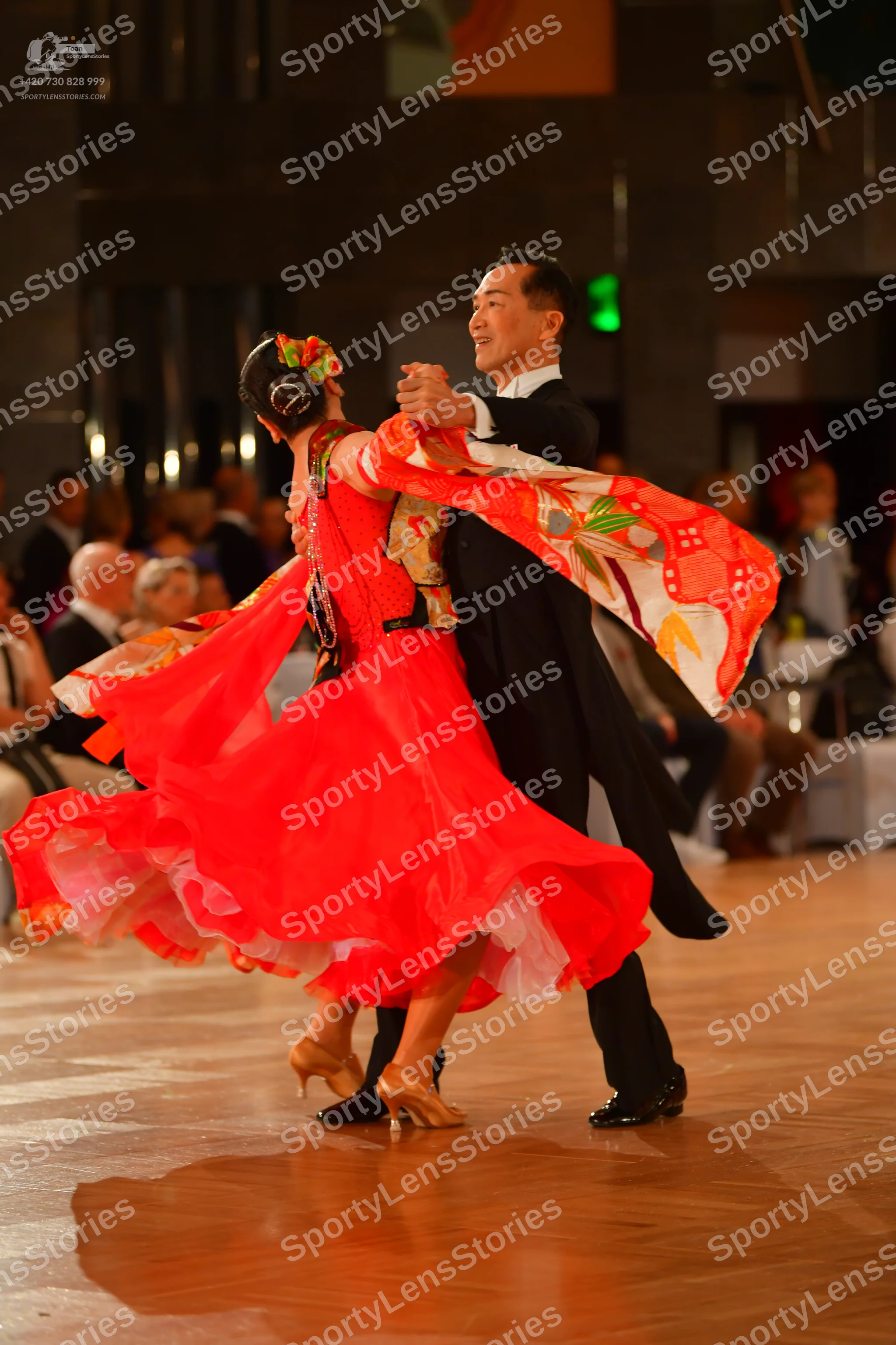 Dancesport competitor: Male dancer: black suit with a white shirt