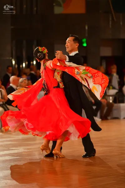 Dancesport competitor: Male dancer: black suit with a white shirt
