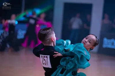 Dancesport competitor: Male dancer: black long-sleeved top
