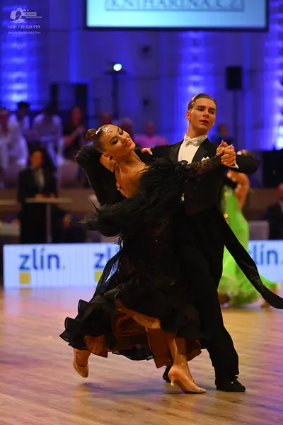 Dancesport competitor: Male dancer: black tailcoat with a white shirt and white bowtie