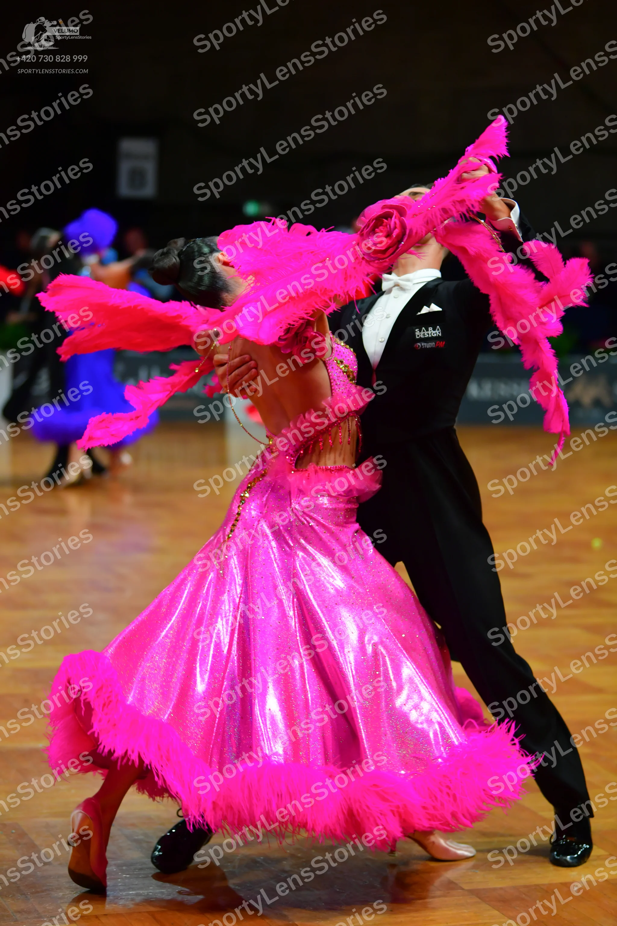 Dancesport competitor: Male dancer: black suit with a white shirt and black bow tie