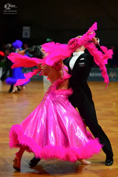 Dancesport competitor: Male dancer: black suit with a white shirt and black bow tie