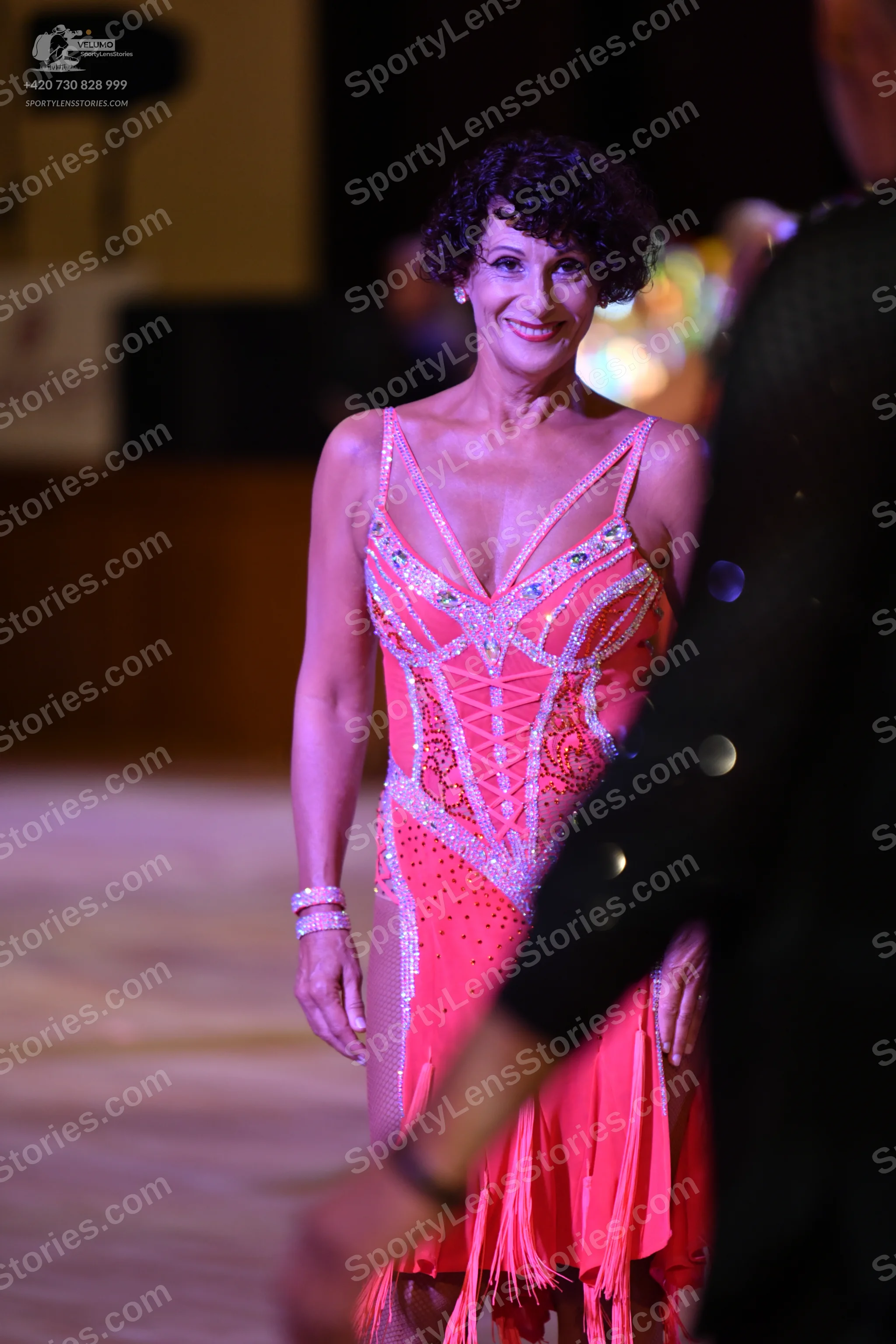 Dancesport competitor: Female dancer: pink latin dress with silver sequins and fringe
