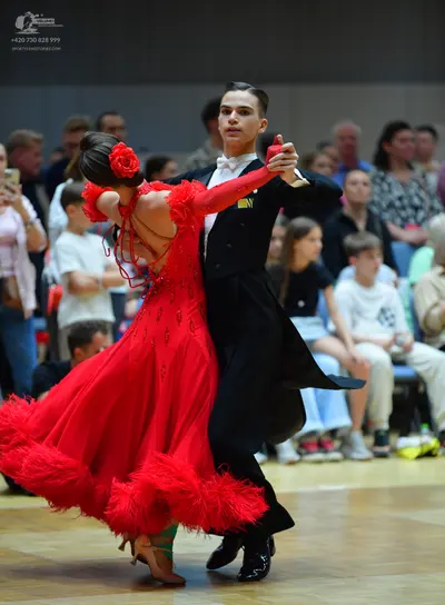 Dancesport competitor: Male dancer: black suit, white shirt, and white bow tie