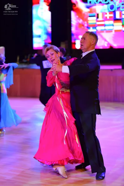 Dancesport competitor: ** Black ballroom suit