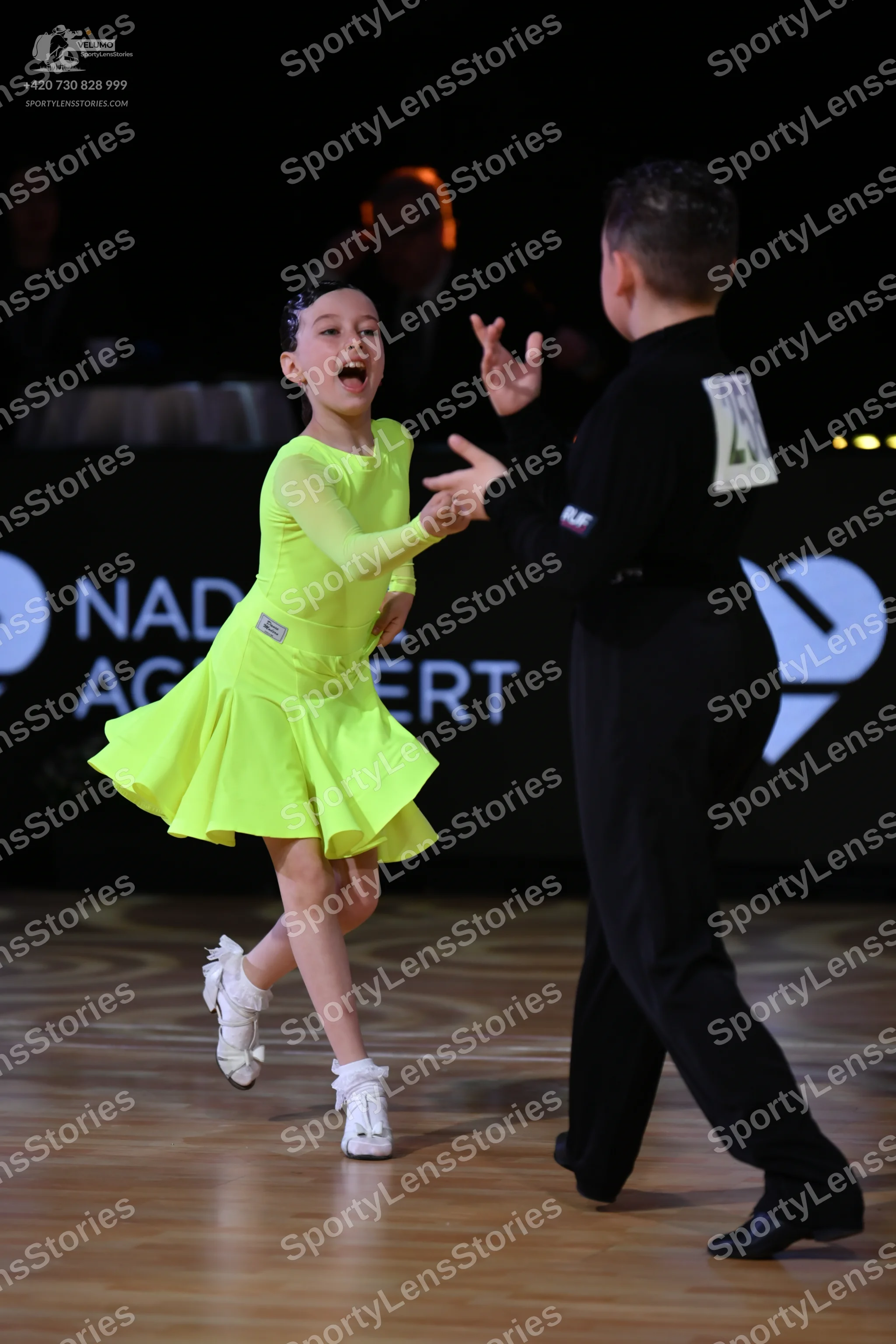 Dancesport competitor: Male dancer: black long-sleeved shirt and black trousers