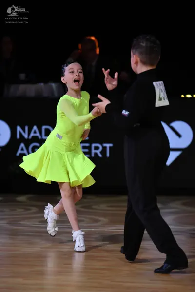 Dancesport competitor: Male dancer: black long-sleeved shirt and black trousers