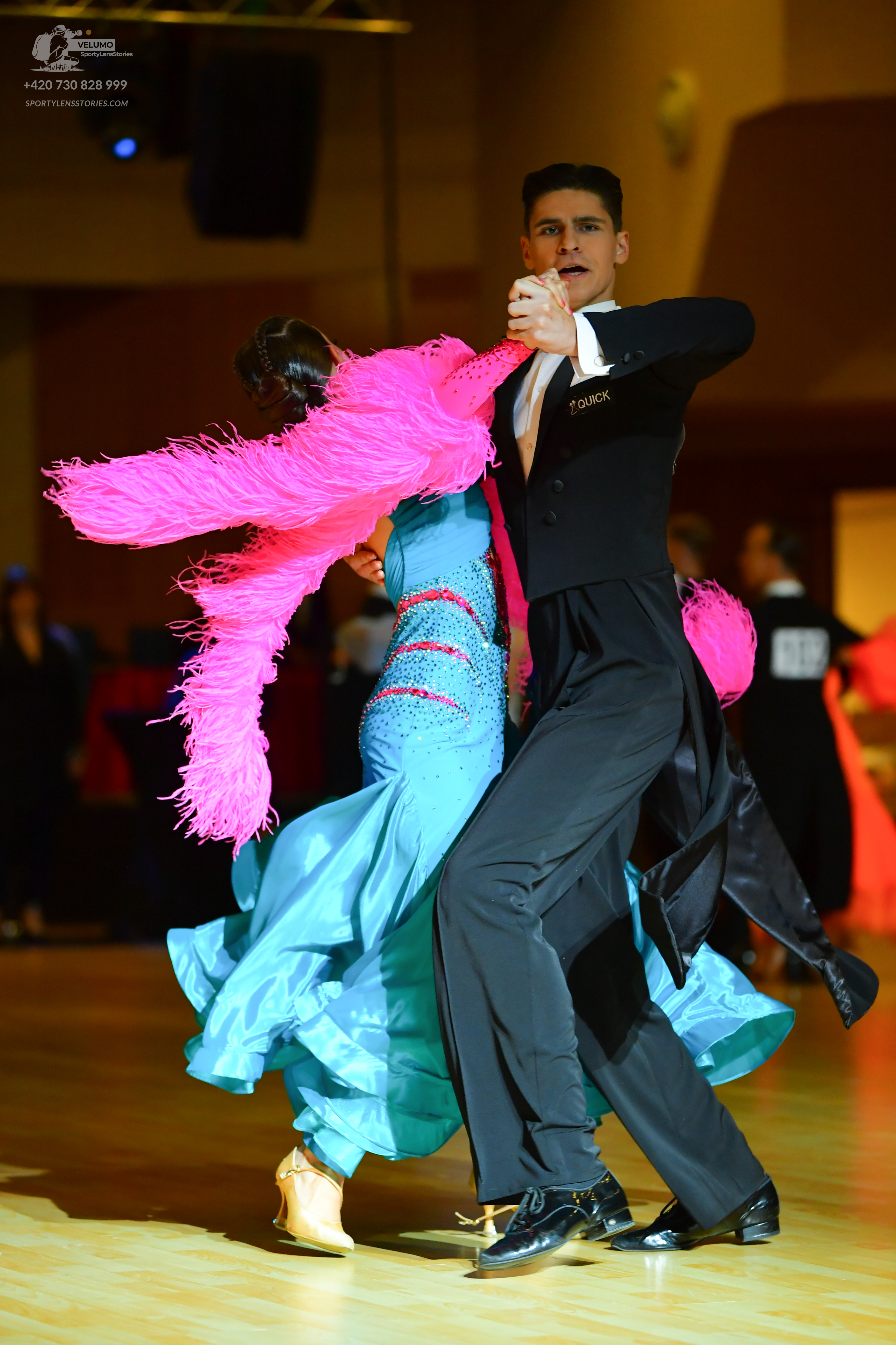 Dancesport competitor: Male dancer: black ballroom suit with a black waistcoat and white shirt