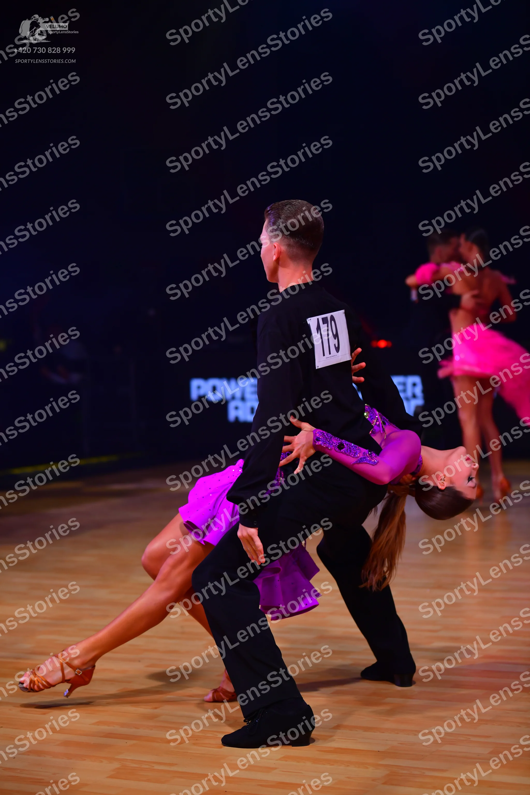 Dancesport competitor: Male dancer: black long-sleeved shirt and black trousers