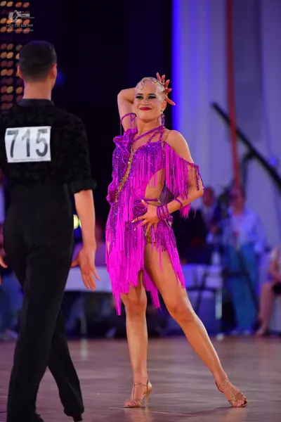 Dancesport competitor #715: Male dancer: black shirt with textured fabric and black trousers