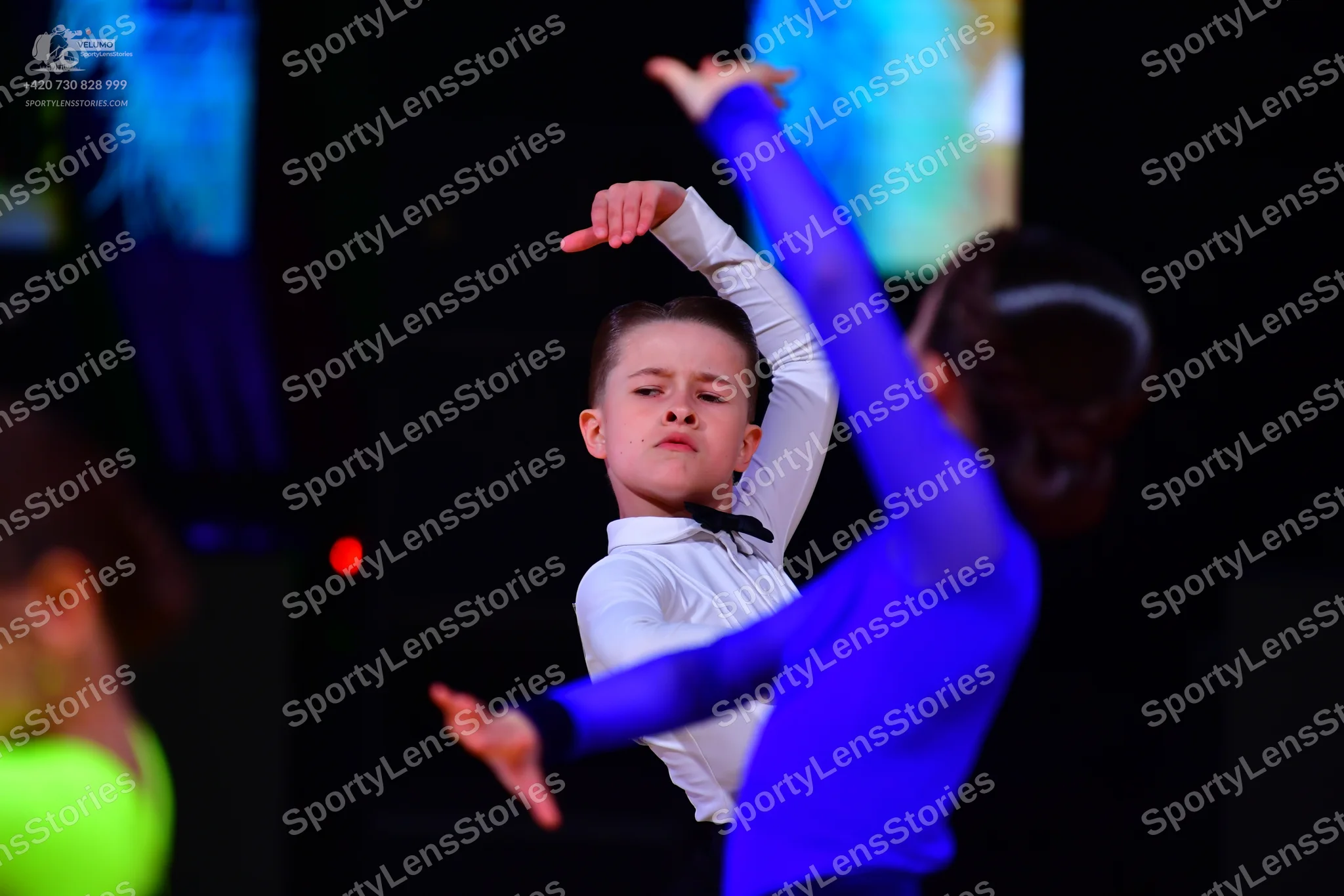 Dancesport competitor: Male dancer: white long-sleeved shirt with a black bowtie and black trousers
