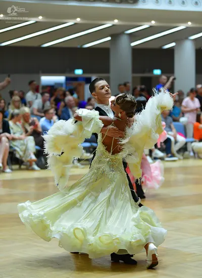 Dancesport competitor: Male dancer: black suit