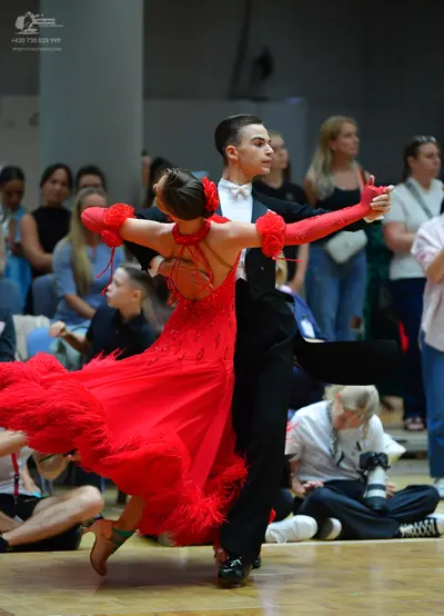 Dancesport competitor: Male dancer: black suit with a white shirt and white bow tie