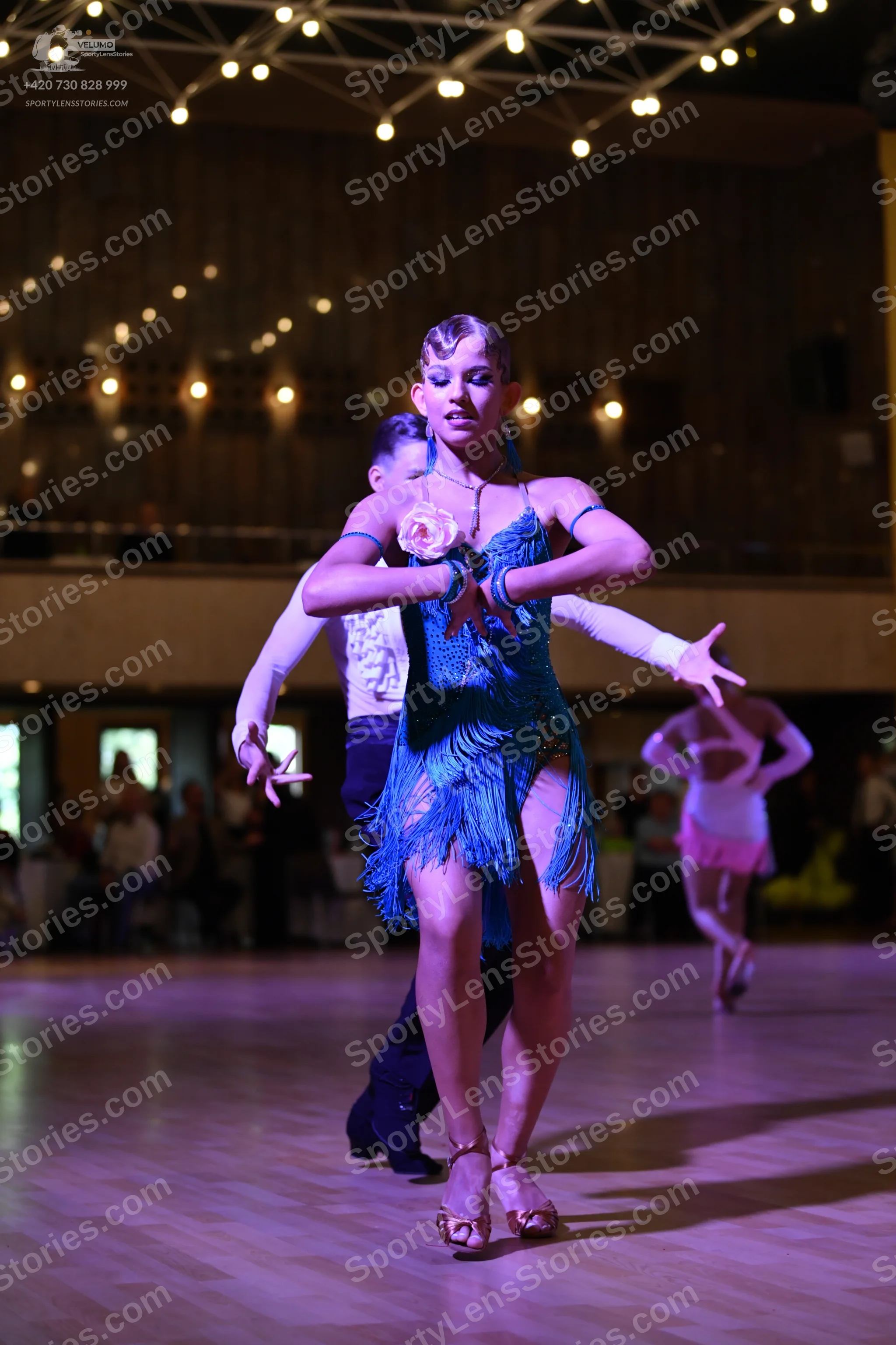 Dancesport competitor: ** Blue Latin dress with fringe and sequins