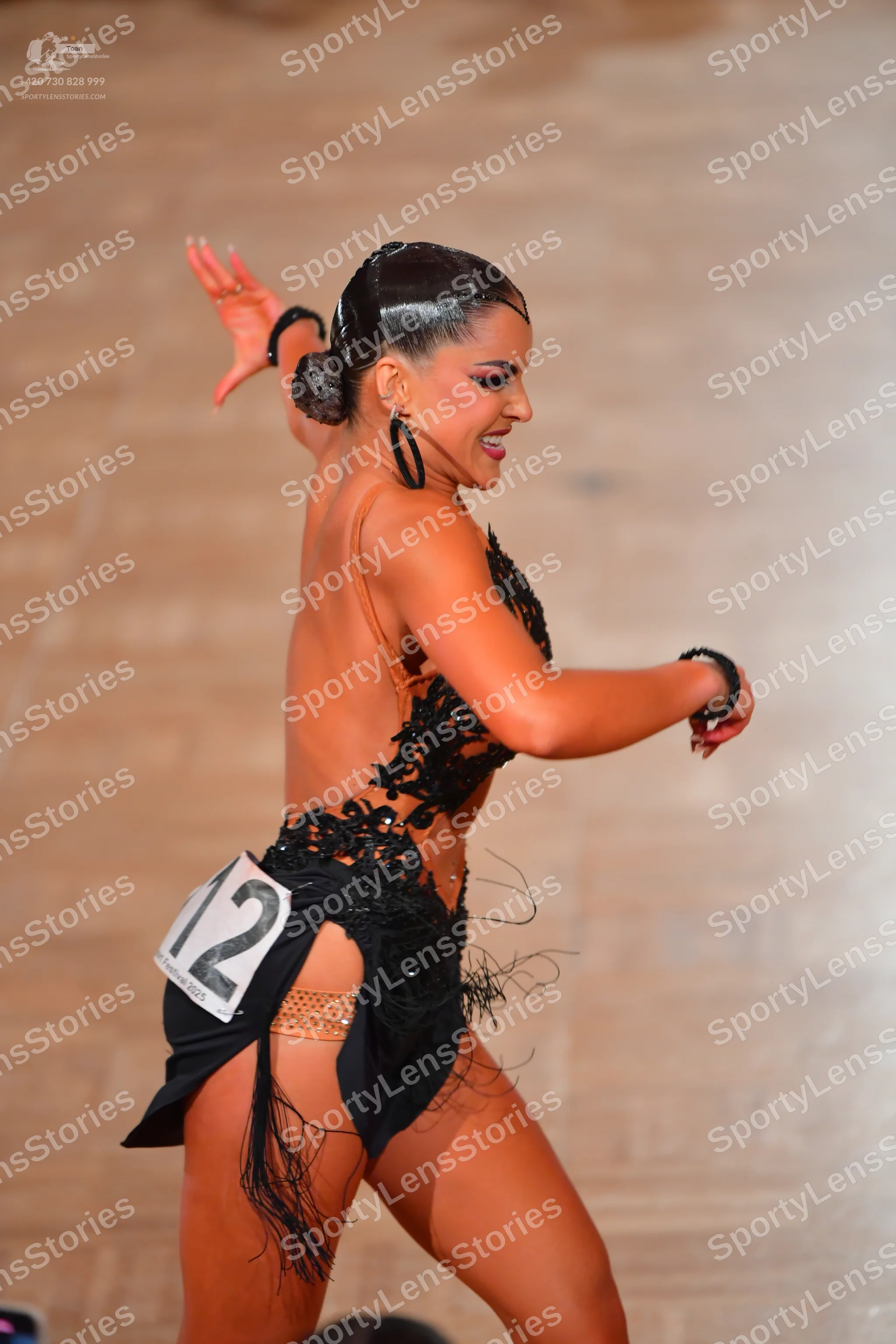 Dancesport competitor #12: Female dancer: black latin dress with sequin and lace bodice and a fringe skirt,