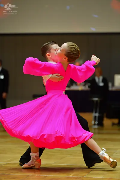 Dancesport competitor: Male dancer: black suit with a white shirt
