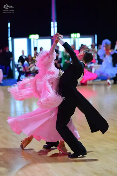 Dancesport competitor: Male dancer: black ballroom tailcoat suit with black trousers