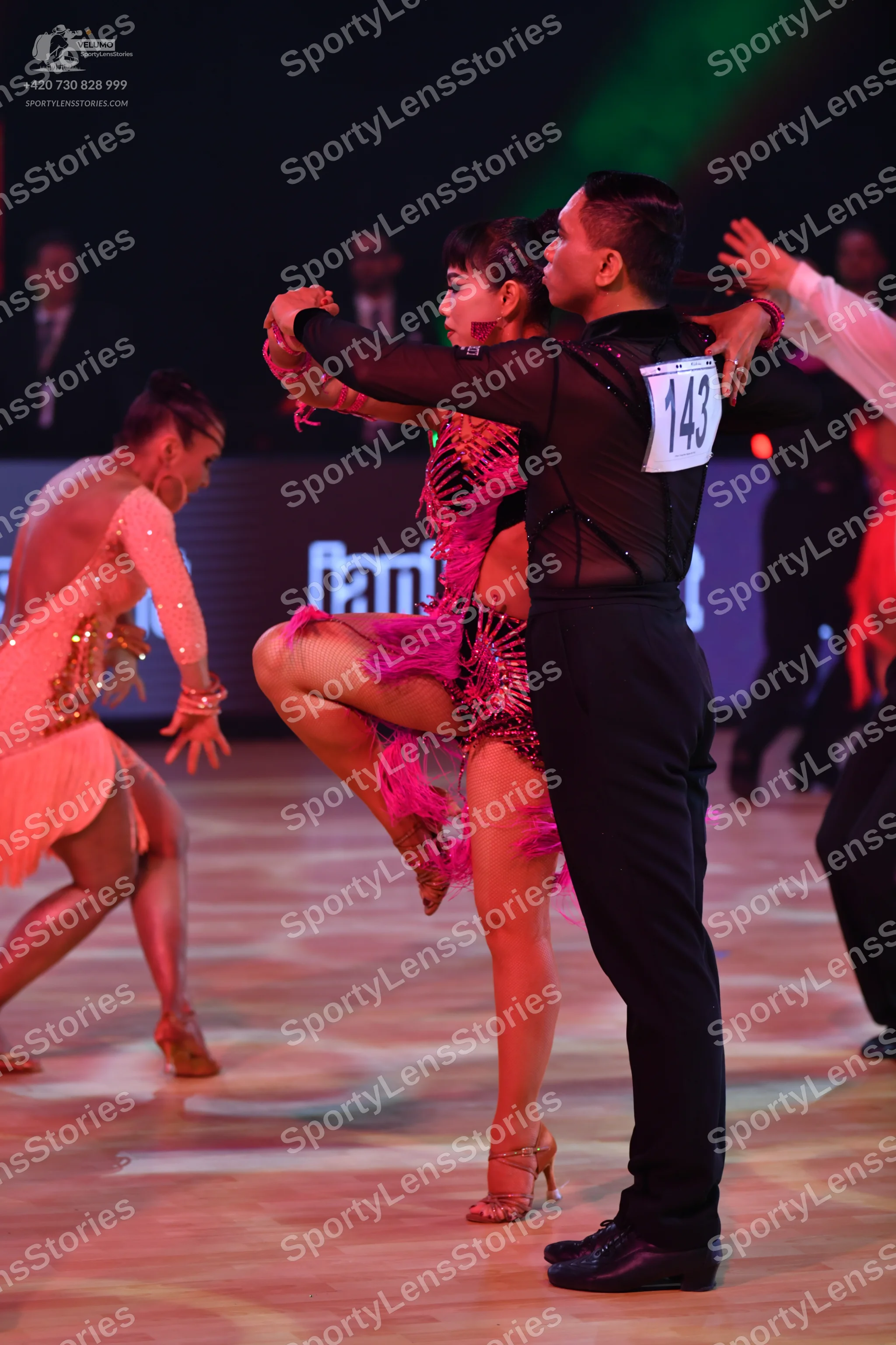 Dancesport competitor: Male dancer: black long-sleeved top with mesh panels and black trousers