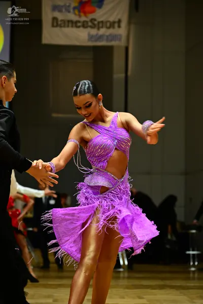 Dancesport competitor: Male dancer: black long-sleeved top