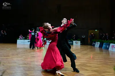 Dancesport competitor #408: Female dancer: red satin ballgown with long sleeves